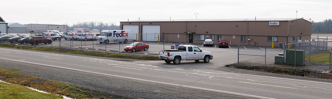 A truck pulls into the lot at the FedEx regional distribution center on Saturday in Burlington, Skagit County. Countless customers point to the facility as a frustrating shipping sticking point.