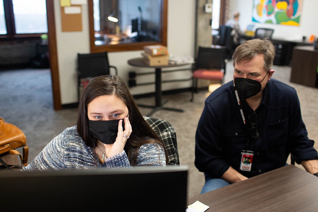 Assignment Editor Elizabeth Kayser and Executive Editor Ron Judd make final edits to the Cascadia Daily News website in the newspaper's Bellingham newsroom Monday morning.