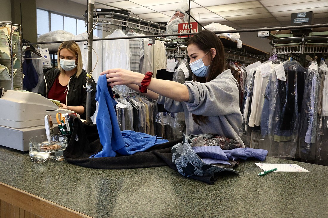 Vienna Cleaners employees Melissa Baier and Shantel Roddey work behind the counter on Feb. 3.