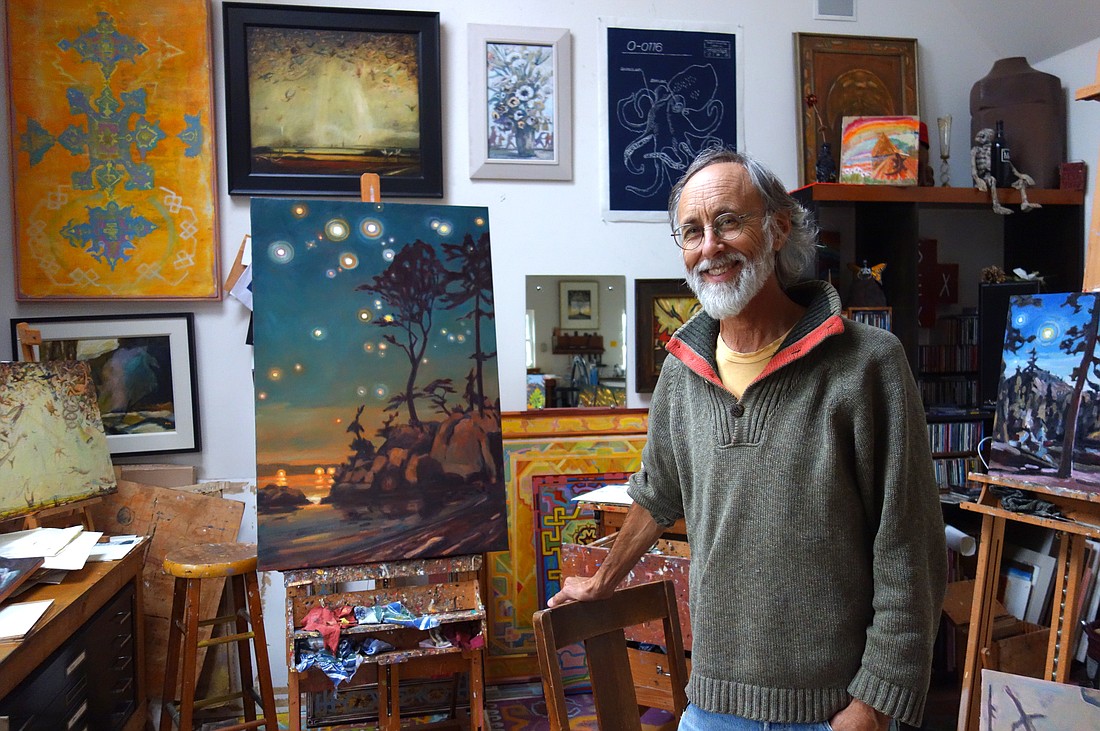 Bellingham artist Tom Wood during a tour at his Oyster Dome Studio in 2018. Most of the pictured artworks are by Wood, though the painting with the white mat is by John Cole, and the octopus print was a collaboration with Mandy Jene Turner and Pieter VanZanden.