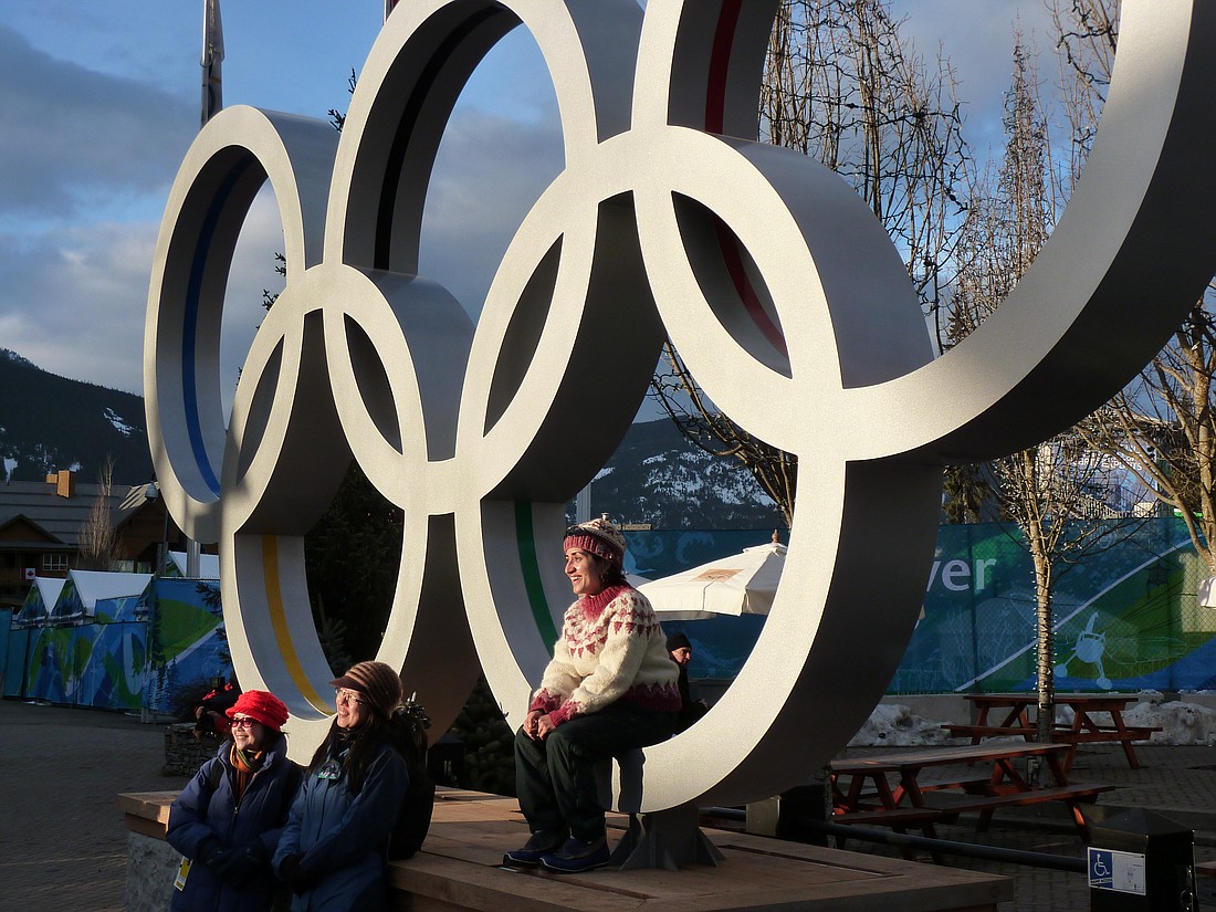 Fans enjoy a moment of sunlight in Whistler, British Columbia during the 2010 Winter Olympic Games.