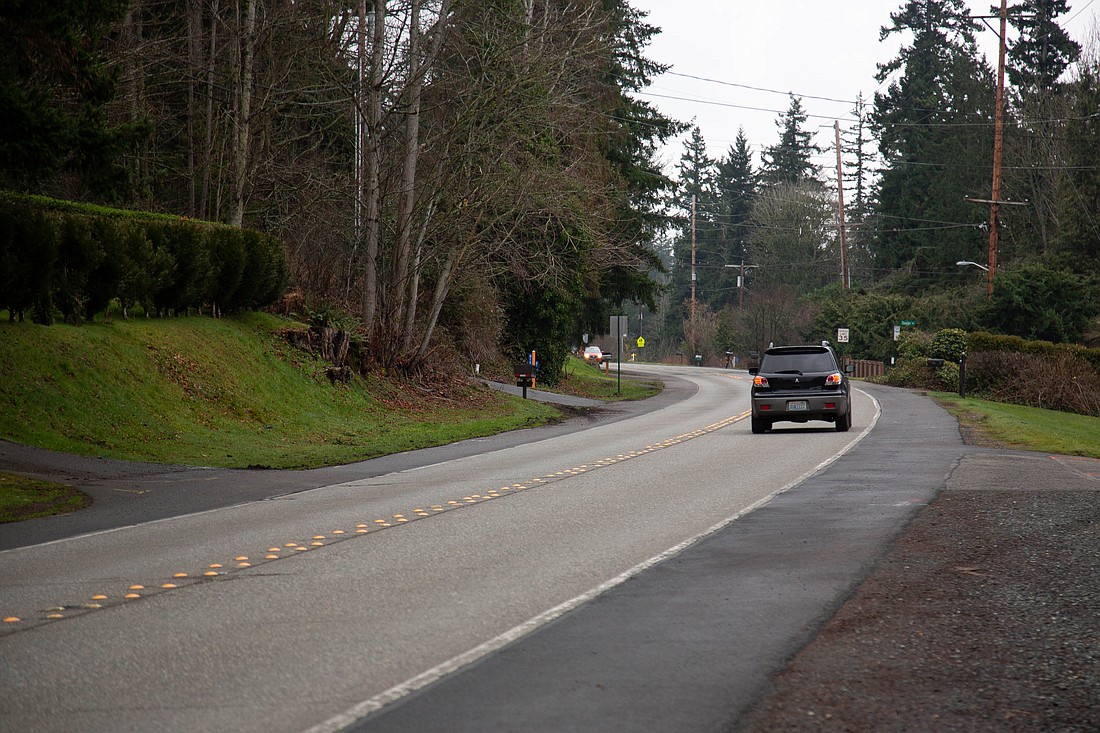 A car heads south on Samish Way, heading toward the Lake Padden area in a neighborhood where an elderly man was struck on a small tractor last week by a silver or white car which fled the scene. Police continue to search for the driver.