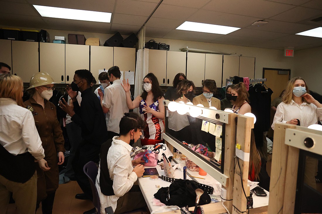 The joyful chaos of intermission unfolds with hair and makeup touch-ups, costume adjustments and the buzz of a very excited cast and crew on opening night at the Squalicum High School auditorium on March 3.