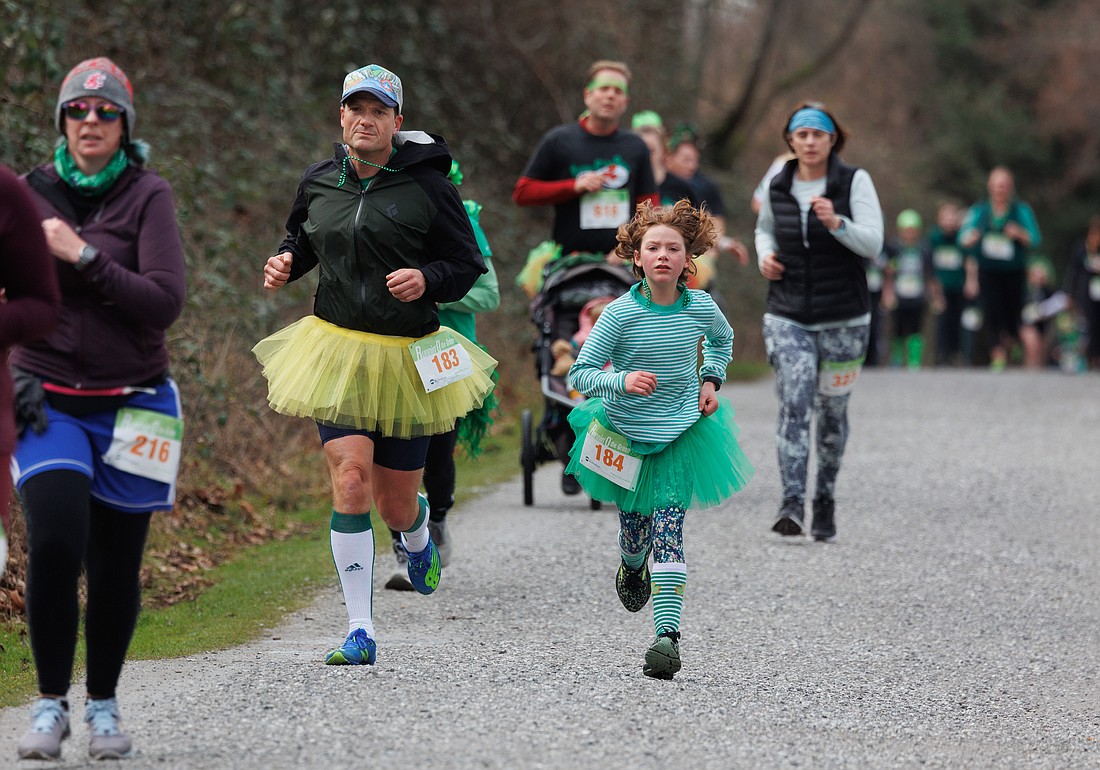 Wearing tutus, David Brown and his daughter Eloise run in the Runnin’ O’ the Green! on March 12 in Bellingham.