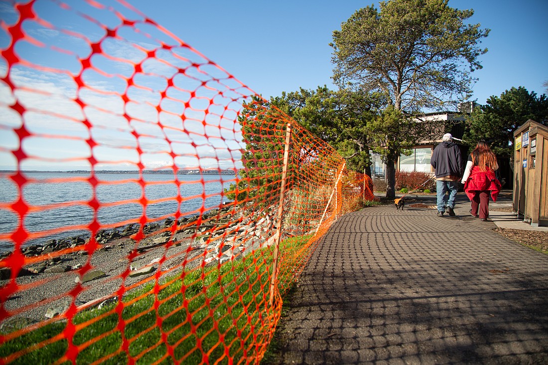 Safety netting keeps pedestrians clear of an eroding beach area along a paved trail at Boulevard Park.