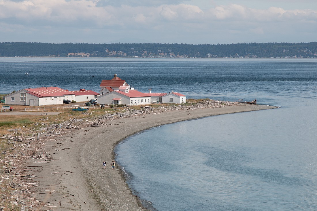 Hikers stroll the beach at Fort Flagler State Park on Marrowstone Island, one of the many Puget Sound state parks where clandestine military training is allowed by the state Parks and Recreation Commission. A court ruling last week overturned the state's permission for the training.