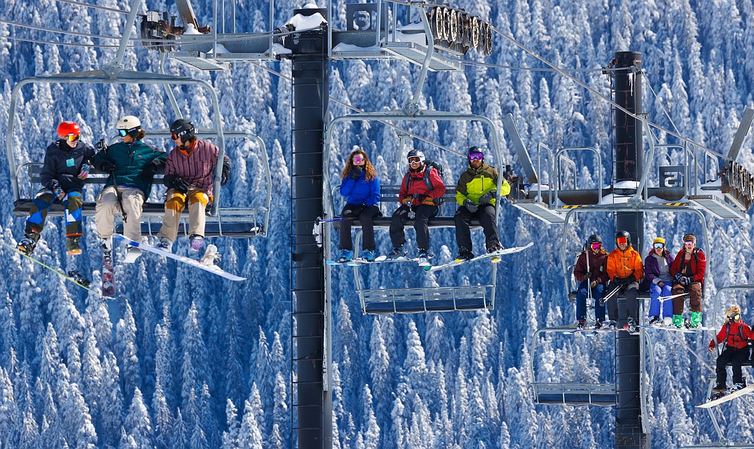 Skiers ride a lift at Mount Baker Ski Area. The ski area is hosting a Golden Egg Hunt before the end of the season. Those who find the golden eggs will win 2022-23 season passes.