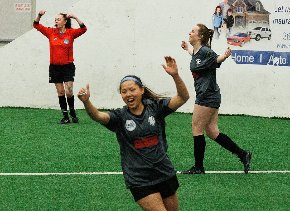 The Whatcom Waves’ Abbey Cowan, right, celebrates scoring a goal against the Tacoma Galaxy at the Bellingham Sportsplex on April 9.
