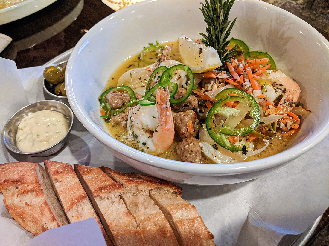 At Cob & Cork, the menu is divided into “land,” “sea,” “start” and “share.” On the “sea” side is the Sicilian prawn bowl, which comes with plenty of bread for mopping up the sauce.