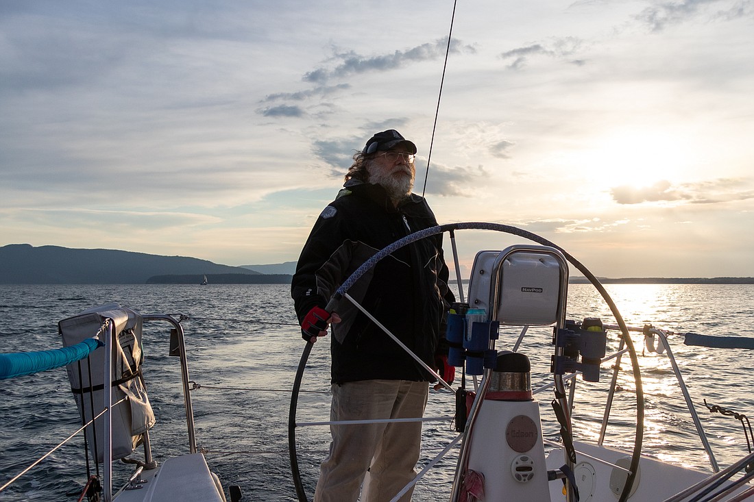 The skipper of Hravn, Todd Koetje, associate professor and department chair of anthropology at Western Washington University, sails back to Squalicum Harbor after completing Thursday night's race on April 14.