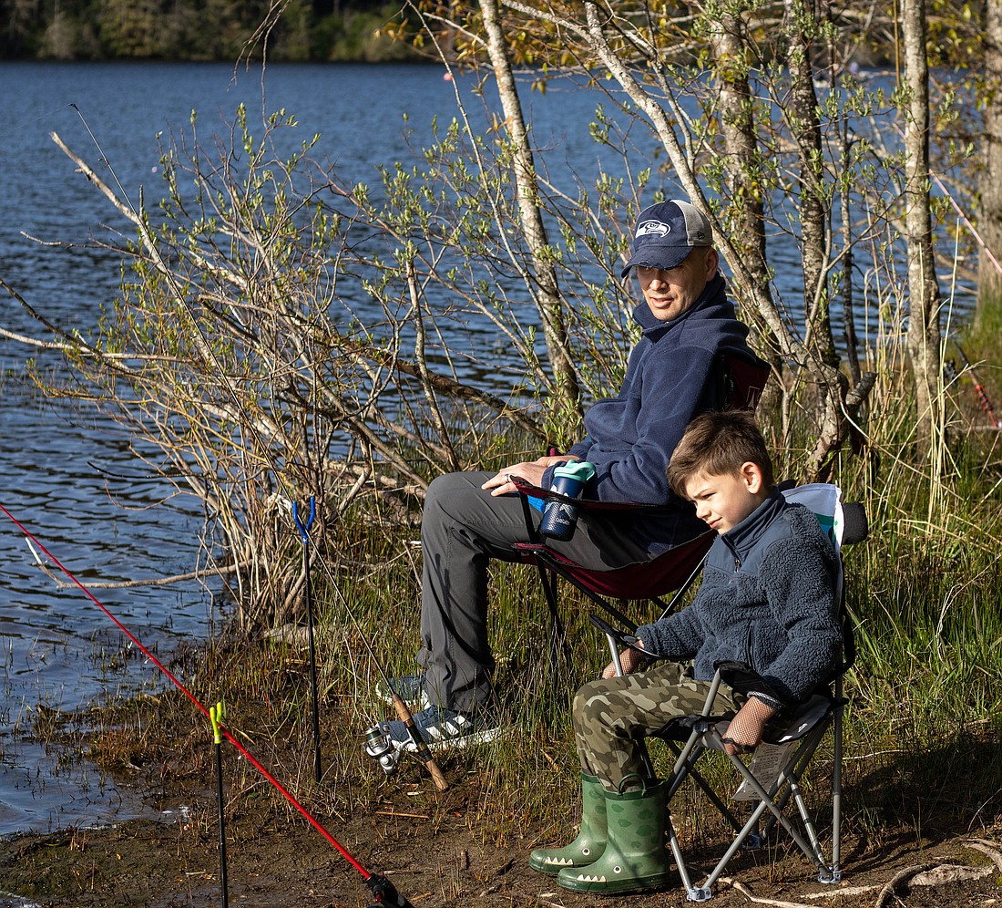 Randy Dorn and his son Landon, 5, set up to catch some fish at Lake Padden on April 23. Dorn has been taking his son fishing since he was 2, continuing the family fishing tradition.