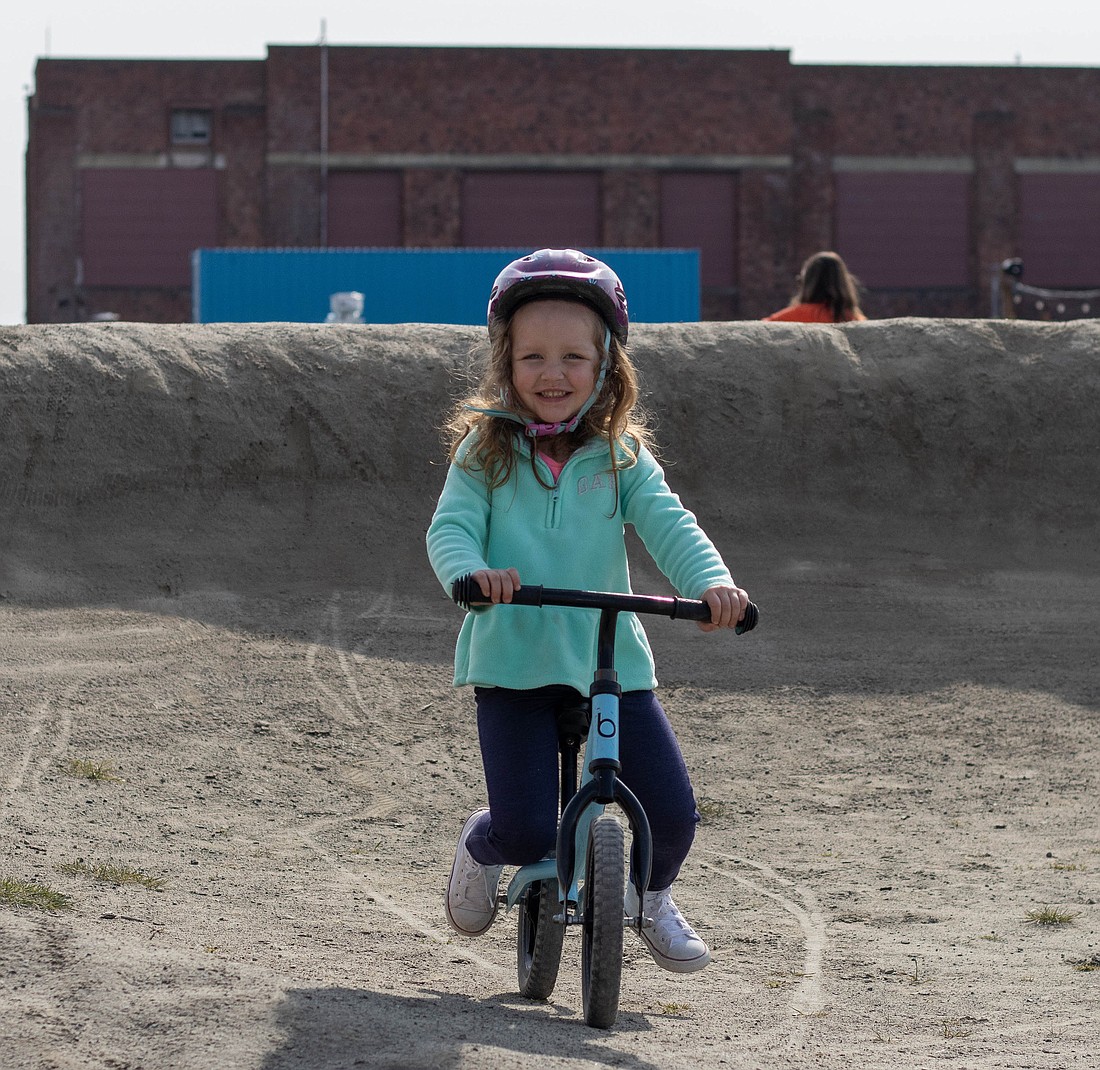 Claire Alward, 4, rides on the waterfront pump track for the first time, on April 23. “I'm so pleasantly surprised because she's not usually so confident, but she's loving this,” Rebekah Alward, Claire’s mother, said.