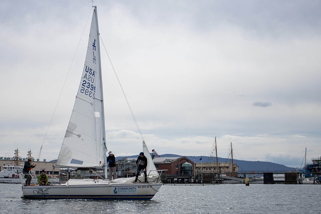 After being fully set up, J-24 sailboat, Wings, takes off into Bellingham Bay.