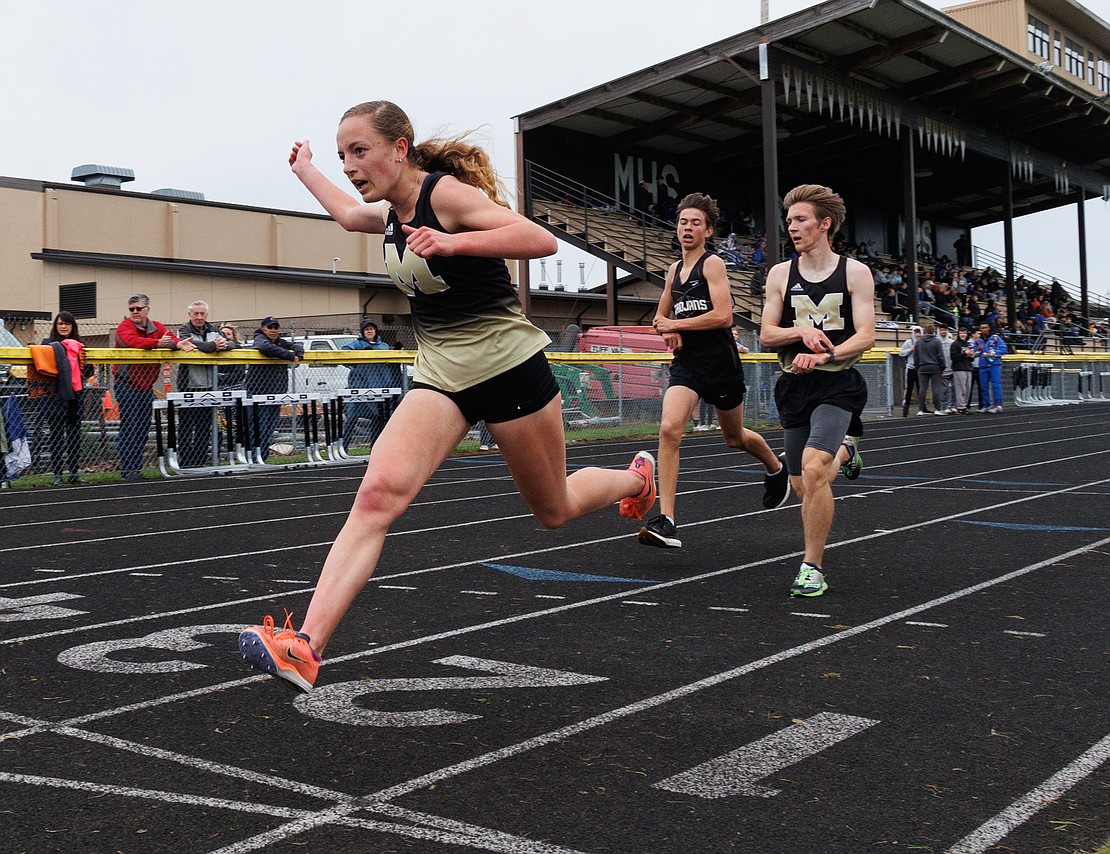 Meridian’s Kayla Aalpoel leans forward and sets a girls school record with a time of 10:58.91 in the 3,200-meter run as Meridian, Blaine and Nooksack Valley competed in a track meet on May 4.