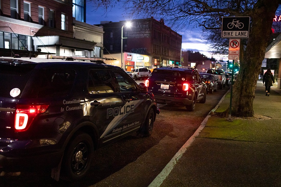 Bellingham police cars line State Street in January as officers respond to a call. The police department has acknowledged it can't keep up with the city's rising crime rate due to an officer shortage.