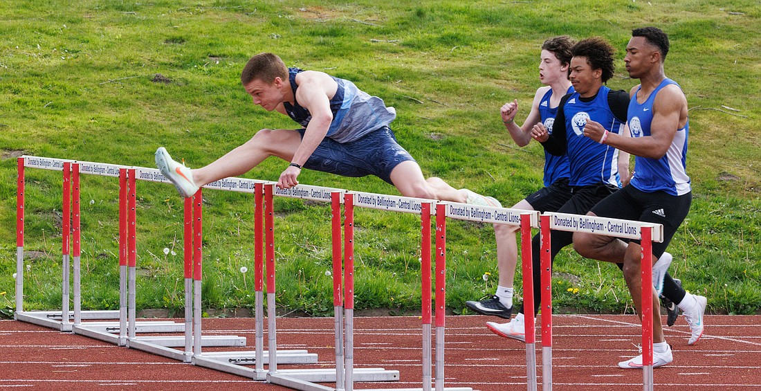 Squalicum’s Andre Korbmacher leaps over the first hurdle en route to breaking the state record in the 110-meter hurdles during the District 1 2A North Sub-Districts track meet at Civic Stadium on May 13.