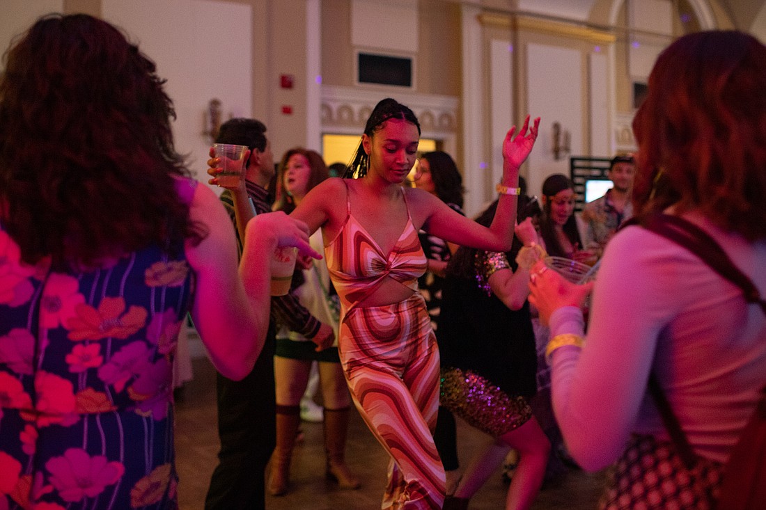 Y’vari Wooten dances to GrooveBot's cover of “Juice” by Lizzo at '70s Beer Prom in the ballroom at the Hotel Leo on May 21. The event featured 13 breweries and benefitted Lydia Place.