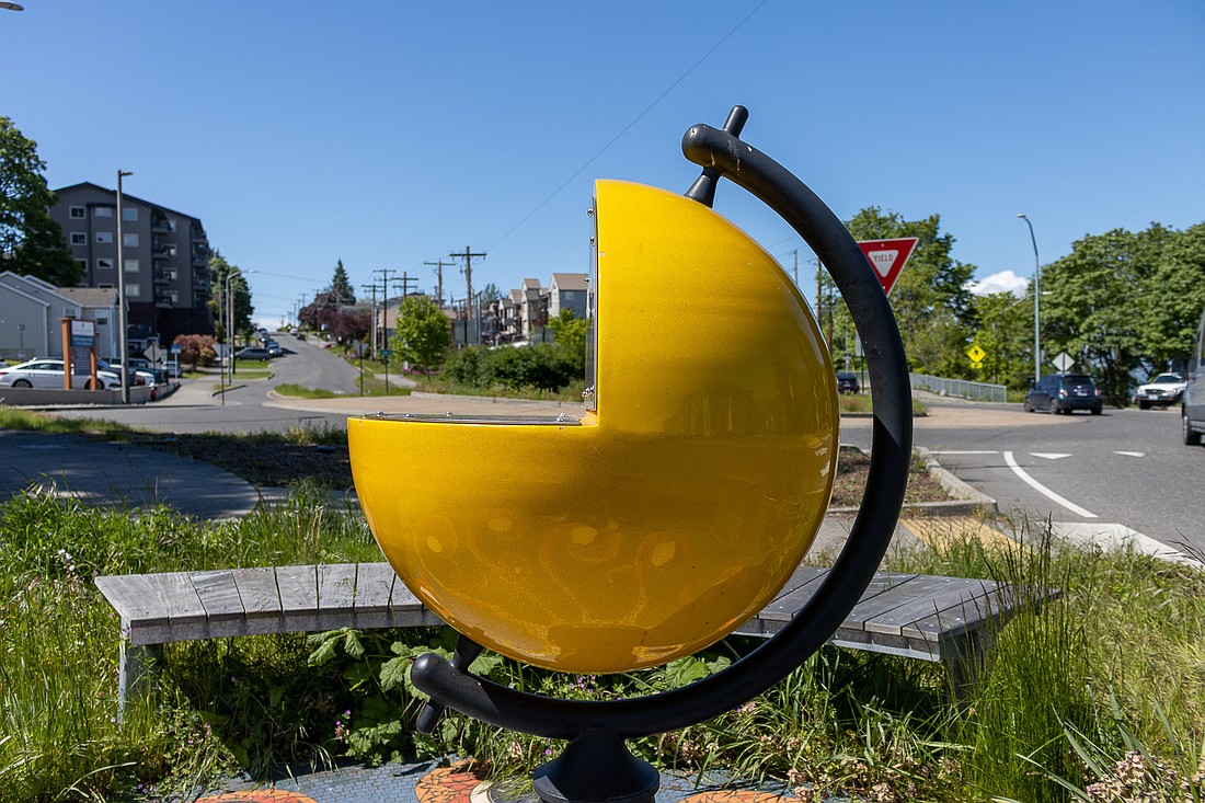 A sculpture of the sun sits by the roundabout on North State Street. From here, the entire solar system is laid out in a straight line, scaled to the real average distance from the sun.