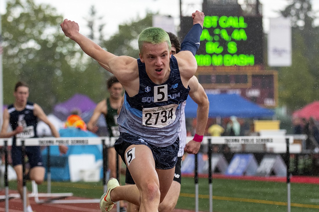 Squalicum's Andre Korbmacher crosses the finish line in first to capture the boys 110-meter hurdle championship at the 2A state track and field championships on May 27 at Mount Tahoma High School.