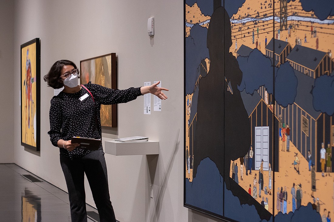 Youth docent Ella Prichard, 15, tells the story behind Roger Shimomura’s piece “American Infamy #2” on May 27. Prichard is one of 10 youth docents at the Whatcom Museum.