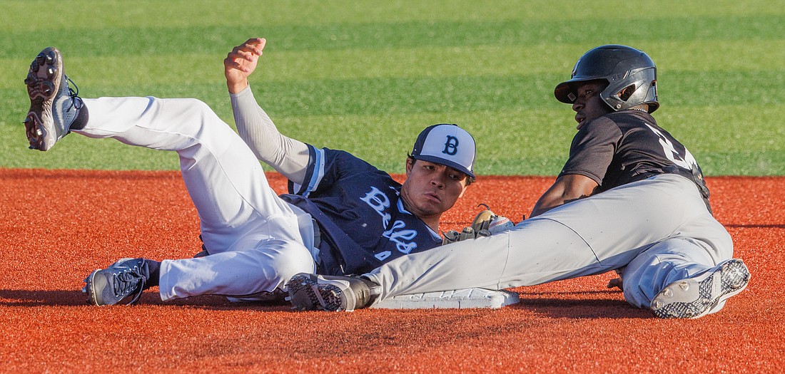 While falling down, Bellingham’s Gavin Schulz tries to make the tag on a Northwest Star Nighthawks player. The Bellingham Bells beat the Nighthawks 4-1.