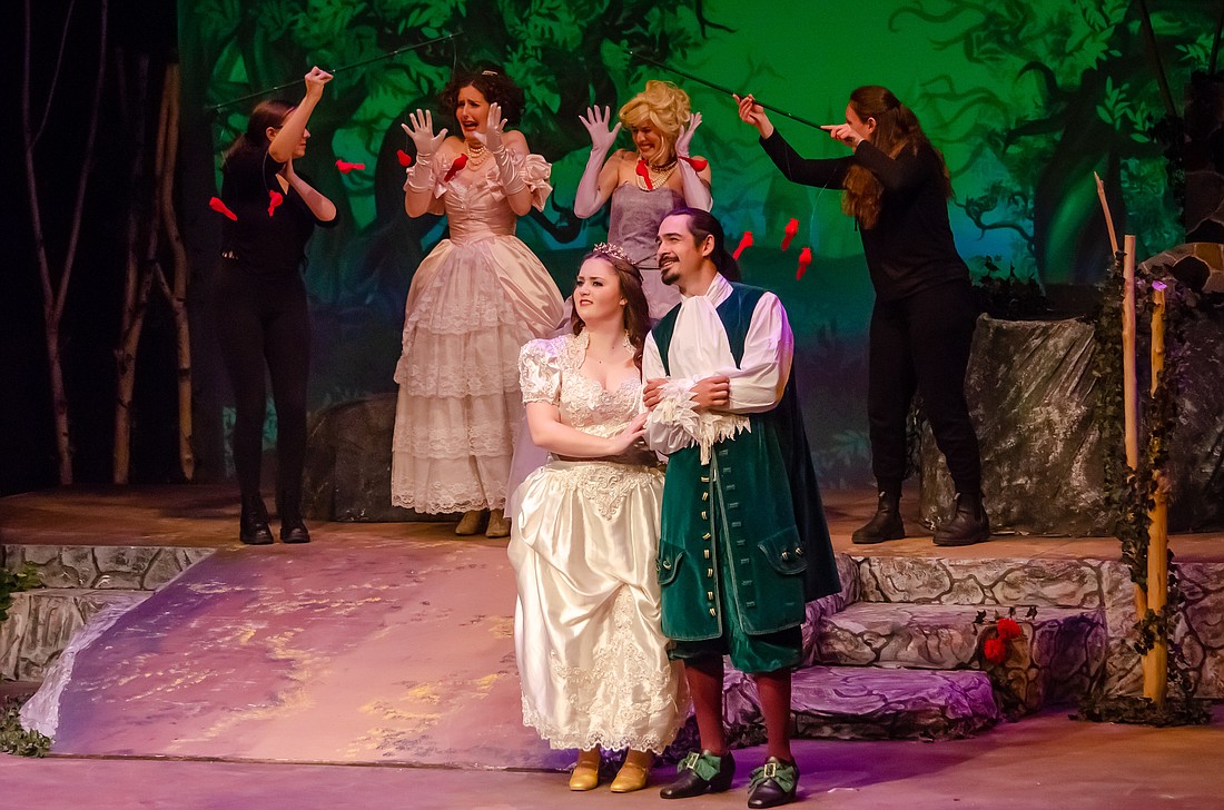 In “Into the Woods,” Cinderella (Megan Sutton) and her prince (Benjamin Usher) celebrate their nuptials while her evil stepsisters (Erin Melanie and Livia Cohen) get their eyes pecked out by avenging birds. The play shows through June 26 at the Bellingham Theatre Guild.