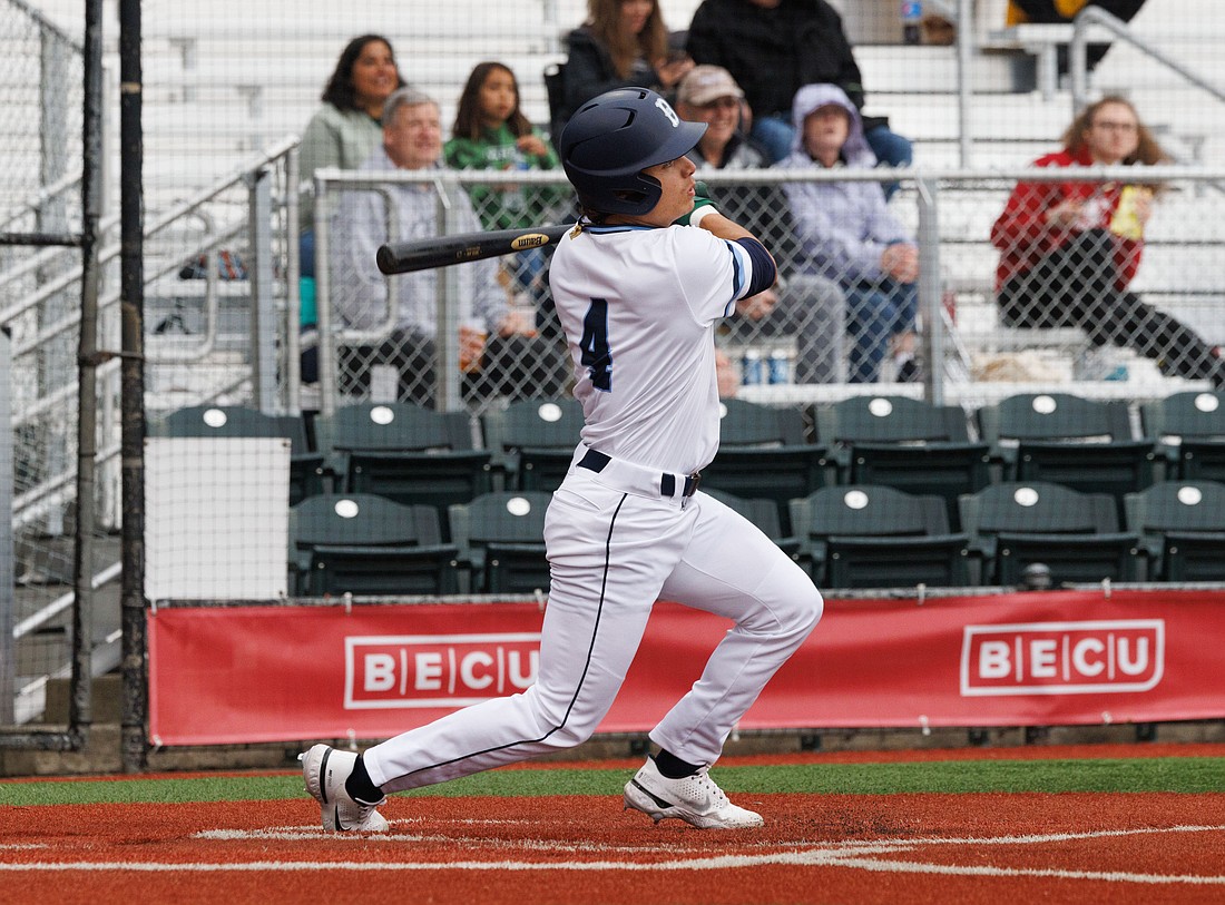 Bellingham's Gavin Schulz watches the ball sail over the outfield wall for a three-run homer as the Bells beat the Wenatchee AppleSox 4-1 at Joe Martin Field on June 15.
