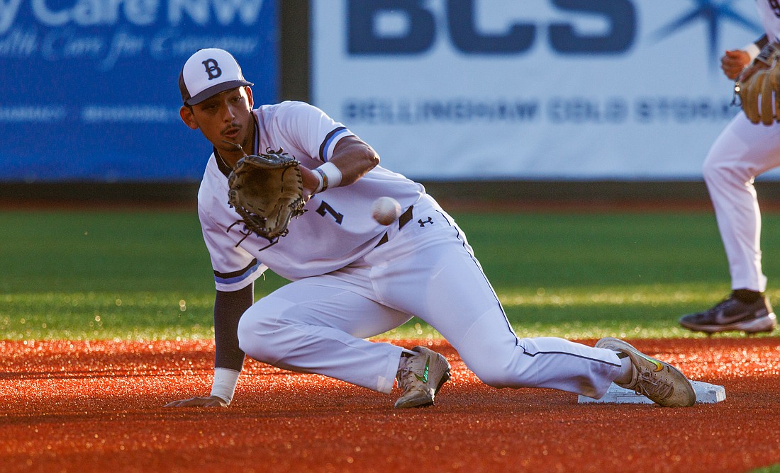 With a runner heading to second base, Bellingham’s Ty Saunders tries to make the play. The Bellingham Bells beat the Port Angeles Lefties 7-3 at Joe Martin Field on June 23.