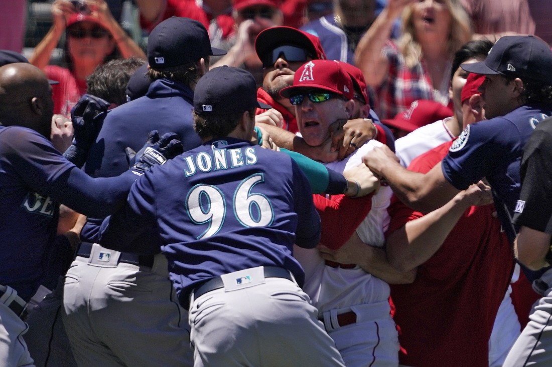 Several members of the Seattle Mariners and the Los Angeles Angels scuffle after Mariners' Jesse Winker was hit by a pitch during the second inning of a baseball game June 26 in Anaheim, Calif.