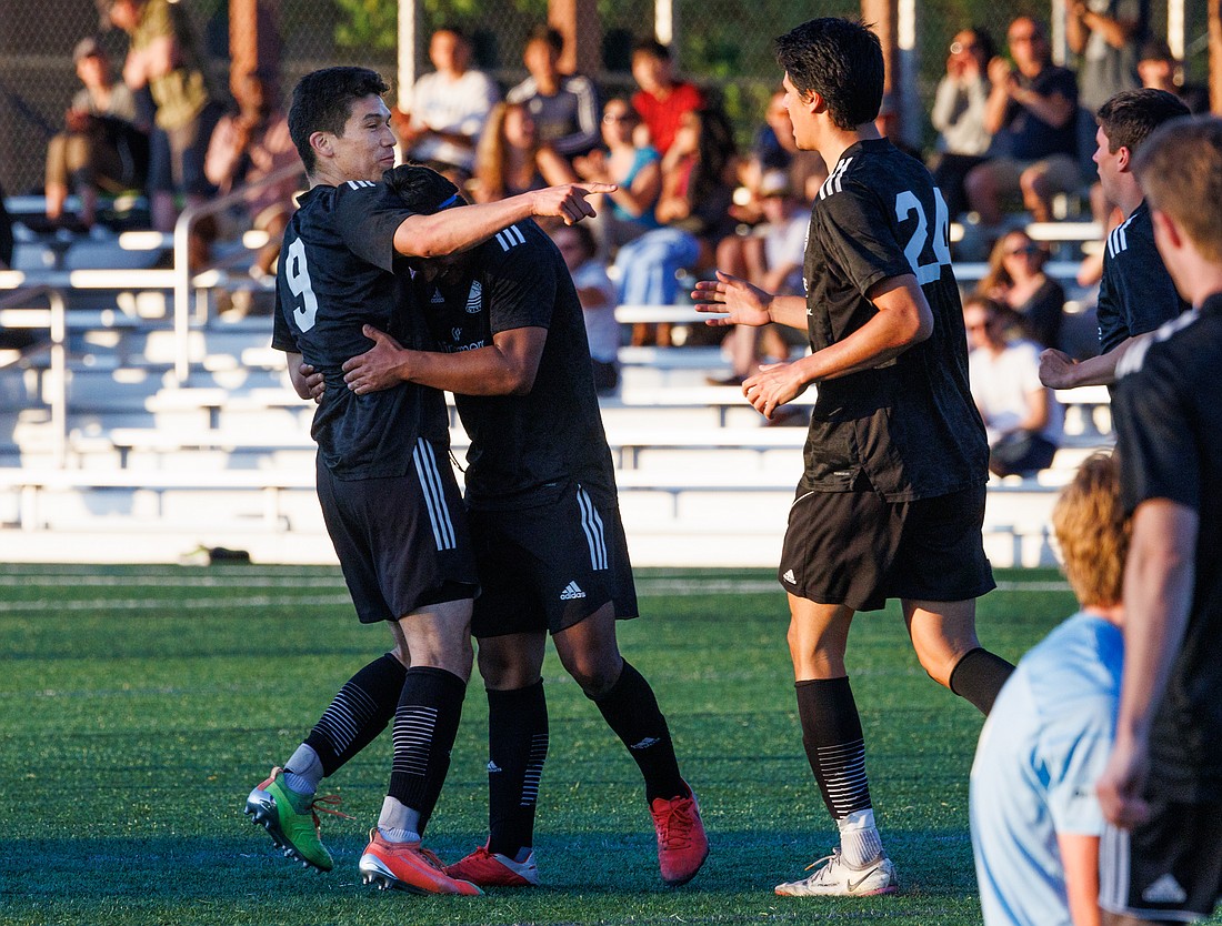 Bellingham United’s Ivan Colin (9) points to teammate Ale Tomasi (24) after scoring the tying goal at Orca Field against Washington Premier at Whatcom Community College on July 1. The final score was 2-2.