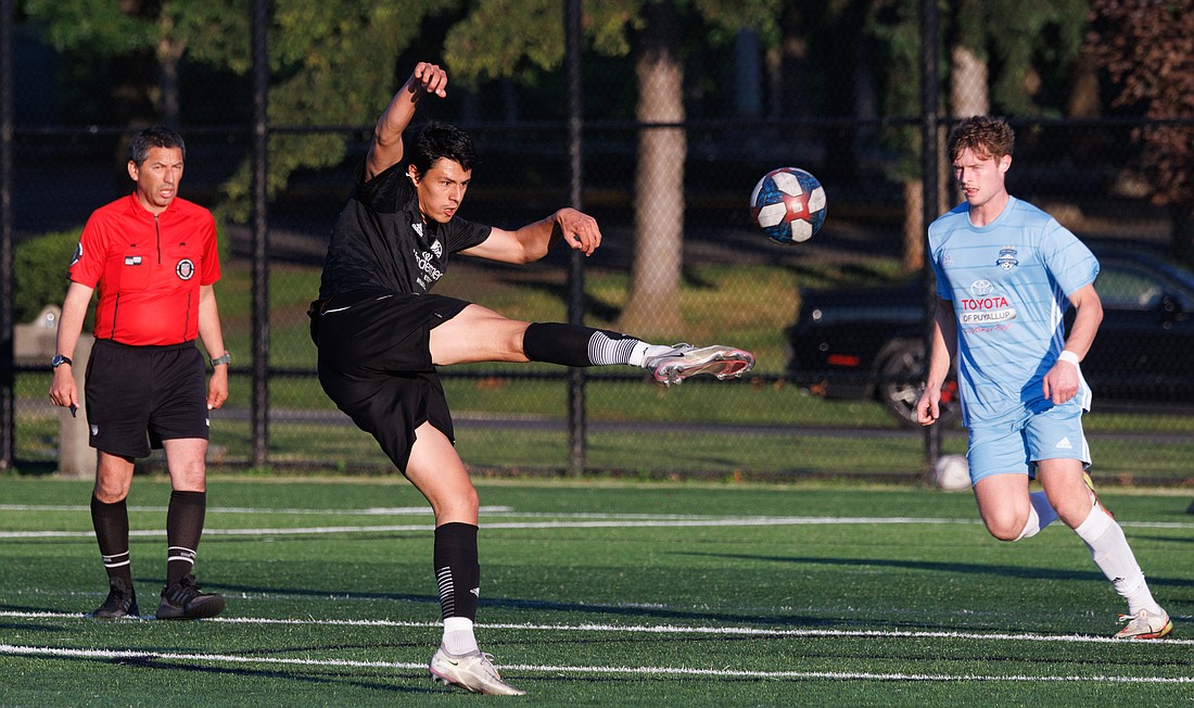 Bellingham United’s Ale Tomasi takes a shot at the goal against Washington Premier on July 1. The game ended in a tie 2-2.