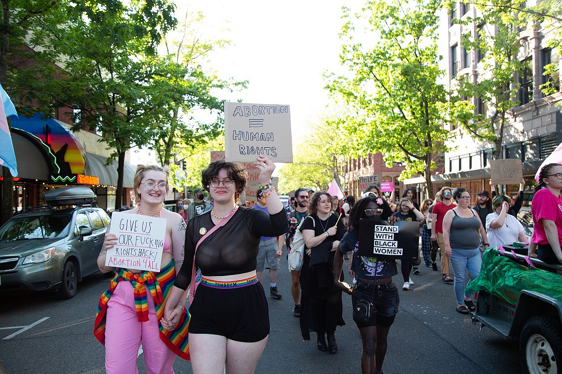 Dozens march straight down Magnolia Street carrying pro-abortion and Black Lives Matter signs on July 1. The group marched in honor of the Stonewall Riots from City Hall, following a Roe v. Wade rally.