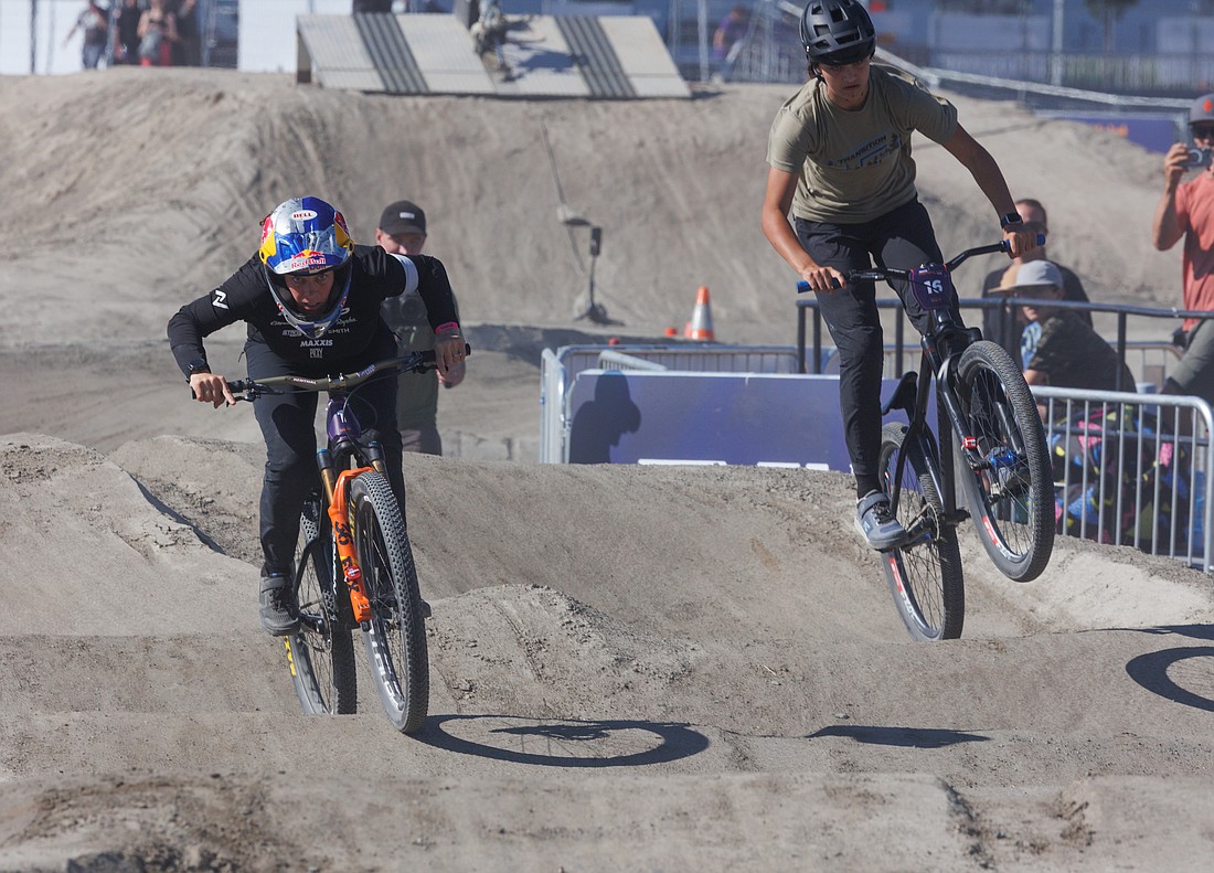 Jill Kintner, 40, left, takes the lead against Matilda Melton, 14, during their race on the pump track at the Northwest Tune-Up on July 8. Kintner won the race, which is two heats on alternating tracks.