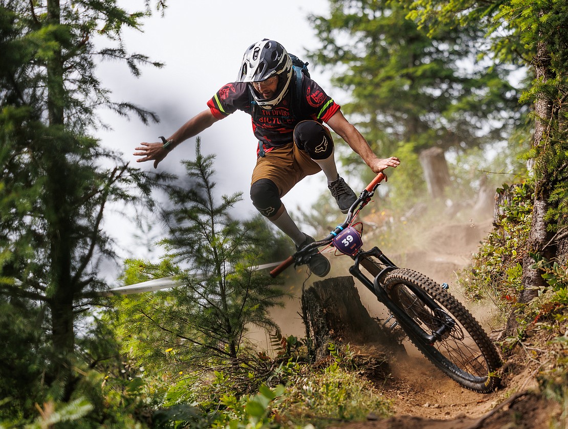 Rowdy Thompson leaps off his bike as he misjudges a section of Spacewolf, a route of an Enduro race at Galbraith Mountain, during the NW Tune Up on July 9.