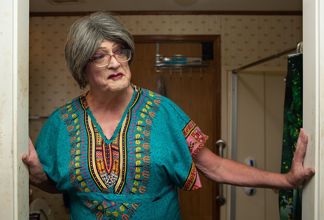 Betty Desire stands in the doorway of her bathroom after getting ready on July 7. The iconic local drag queen has been a leader of the LGBTQ+ community in Bellingham for decades.