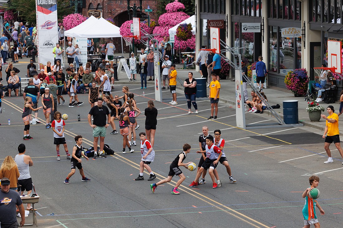 Dozens of teams compete in the Northwest Raspberry Festival's 3-on-3 basketball tournament.