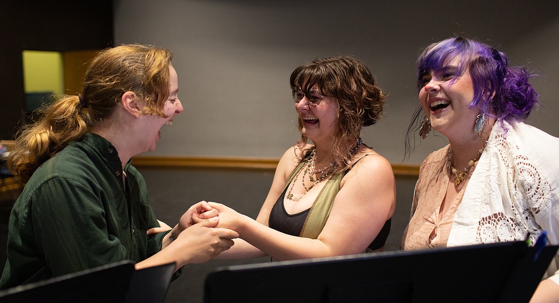 From left, Sarah Williams as Bee, Ella Hieronymus as Freddie and Jo Graves as Voice Of God laugh together while rehearsing the musical “Untethered” at Western Washington University on July 24. The play will run at WinkWink Boutique from Thursday, July 28, through Saturday, July 30.