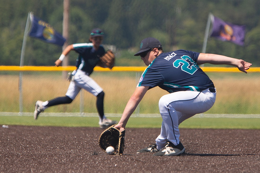 Whatcom Prep 13U first baseman Landon Rowley snags a grounder for an out in the game against Stilly Venom at the Lummi Playfields in Ferndale on July 29. Whatcom Prep won the semifinal game 6-3 in the Pacific Northwest Babe Ruth Regional Tournament.