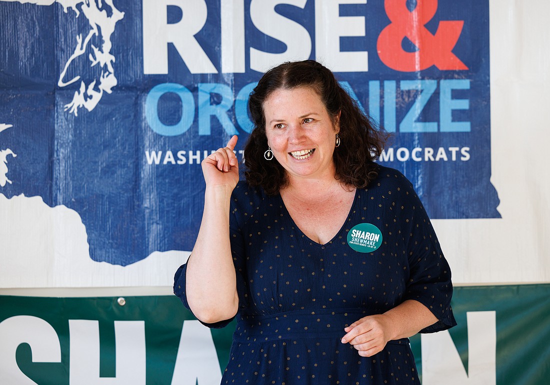 Washington state Senate candidate Sharon Shewmake talks to supporters in Bellingham before knocking on doors to get out the vote on July 27. Two conservative political action committees have targeted Shewmake with more than $184,000 in spending on negative political ads.