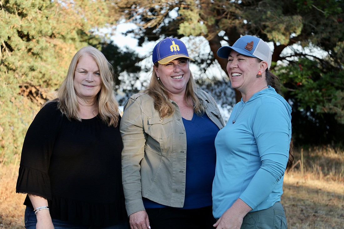 Representative Alicia Rule, center, poses with supporters Shelli Tench, left, and Heather Saulsbury, right, at a barbecue in Semiahmoo during Tuesday's primary election. Based on preliminary results, Rule will advance to November's general.