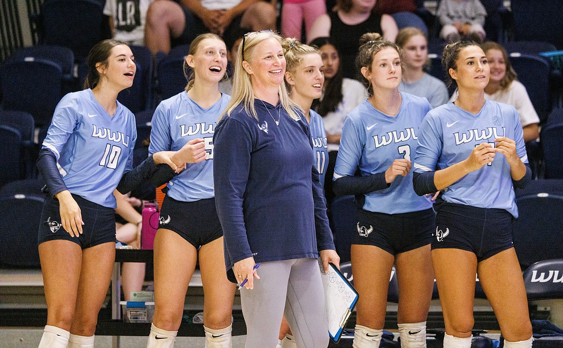 Western Washington University head coach Diane Flick-Williams smiles during an exhibition match against Corban University on Aug. 13. The Vikings are returning nearly their entire roster that reached the NCAA Division II national semifinals last season.
