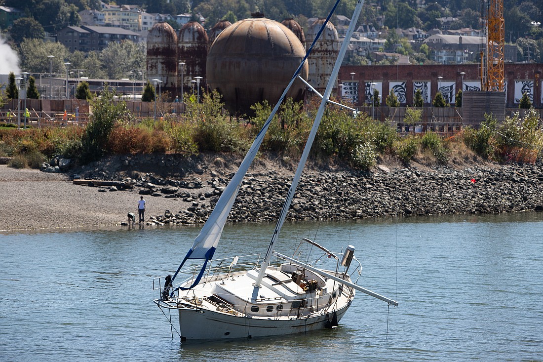 Hands off: Best to leave that grounded sailboat to rot in place, just like the "iconic" Acid Ball lurking nearby, as a feature, not a bug of local tourism strategy, suggests columnist Ron Judd. The sailboat is seen beached near Waypoint Park on Aug. 15.