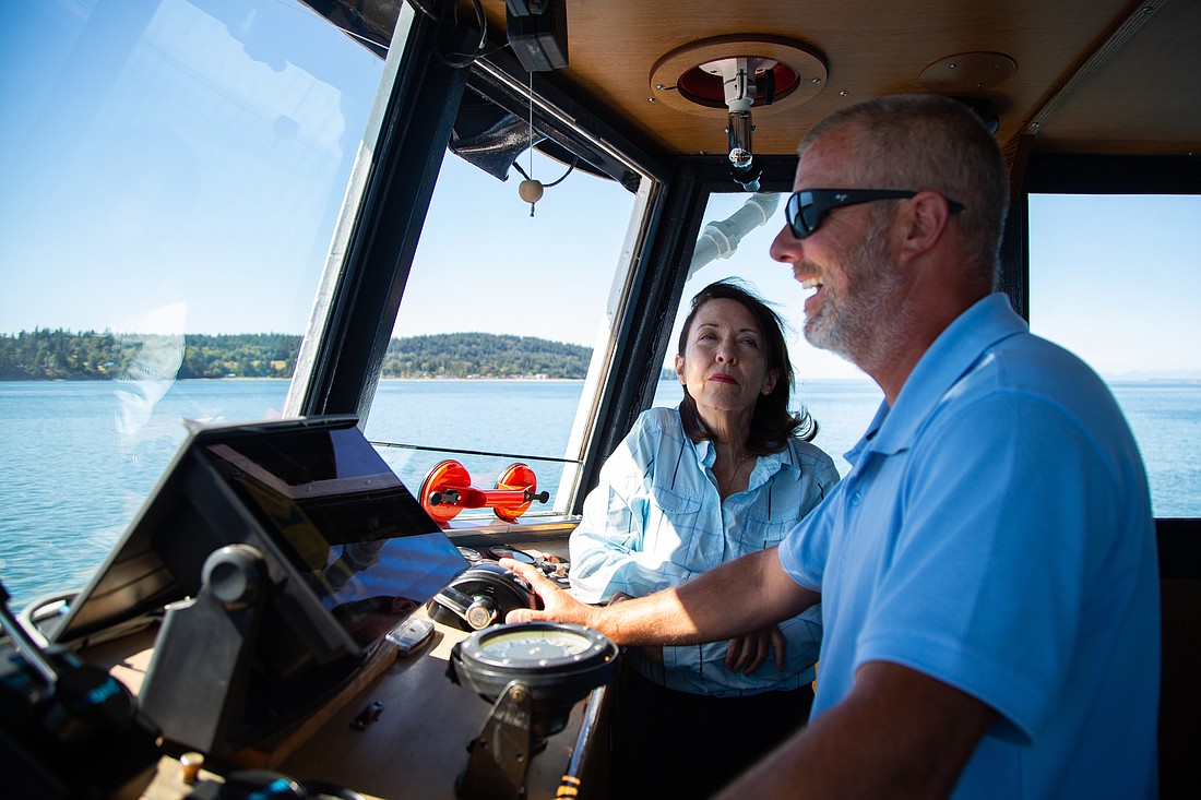U.S. Sen. Maria Cantwell chats with mate John Mulhern in the bridge of the Whatcom Chief on a trip to Lummi Island on Aug. 16. The senator was in Whatcom County to tout a $25 million federal grant that will help fund the 60-year-old Whatcom Chief's replacement.