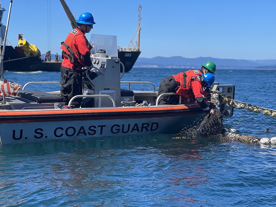 Divers have struggled to remove fuel containers from the Aleutian Isle, a fishing vessel that sank near the San Juan Islands Aug. 13.