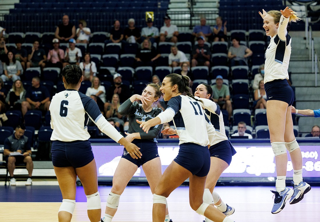 Western Washington University players celebrate as Malia Aleaga (6) scores an ace on the first serve of the game. The Vikings took on Sonoma State in the WWU Invitational on Aug. 25.
