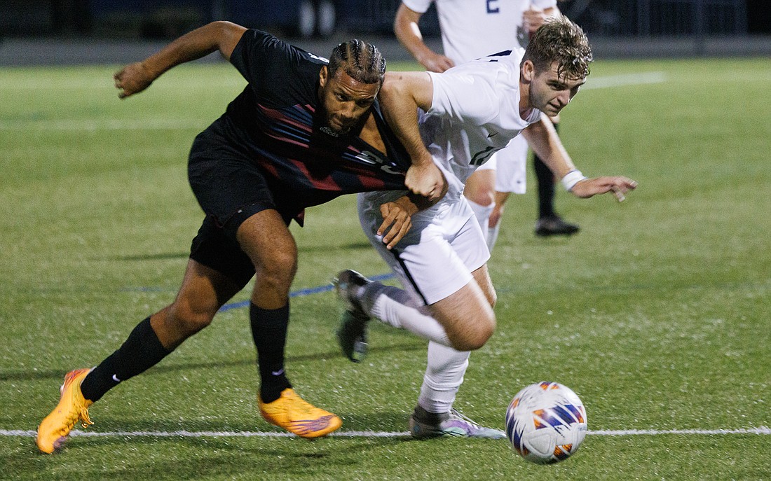 Western Washington University’s Eric Bunnell tangles with a Chico State defender while battling for the ball. The Vikings won 1-0 on Aug. 27.