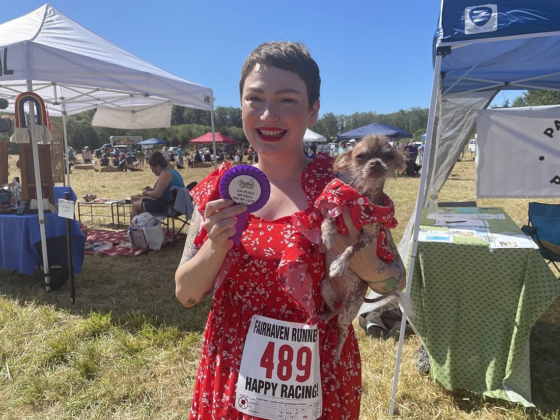 Kymi Jo holds her dog, Cricket, the first-place winner of the "So ugly you're cute" contest at Whatcom Humane Society's annual Dog Days of Summer Festival on Aug. 28.
