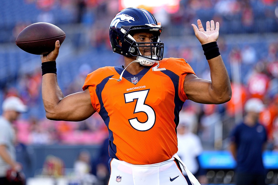 Denver Broncos quarterback Russell Wilson (3) warms up prior to an NFL preseason football game against the Minnesota Vikings, Saturday, Aug. 27, in Denver.