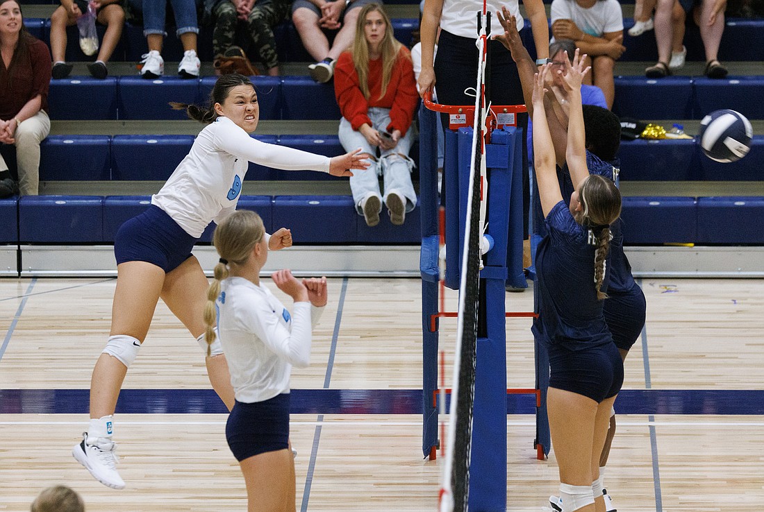 Lynden Christian's Malia Johnson spikes the ball past Ferndale in the second game on Sept. 8. Ferndale beat Lynden Christian with a tiebreaker game 25-21, 9-25, 25-20, 25-27, 18-16. The game was the first to be held in the new gym at the high school.
