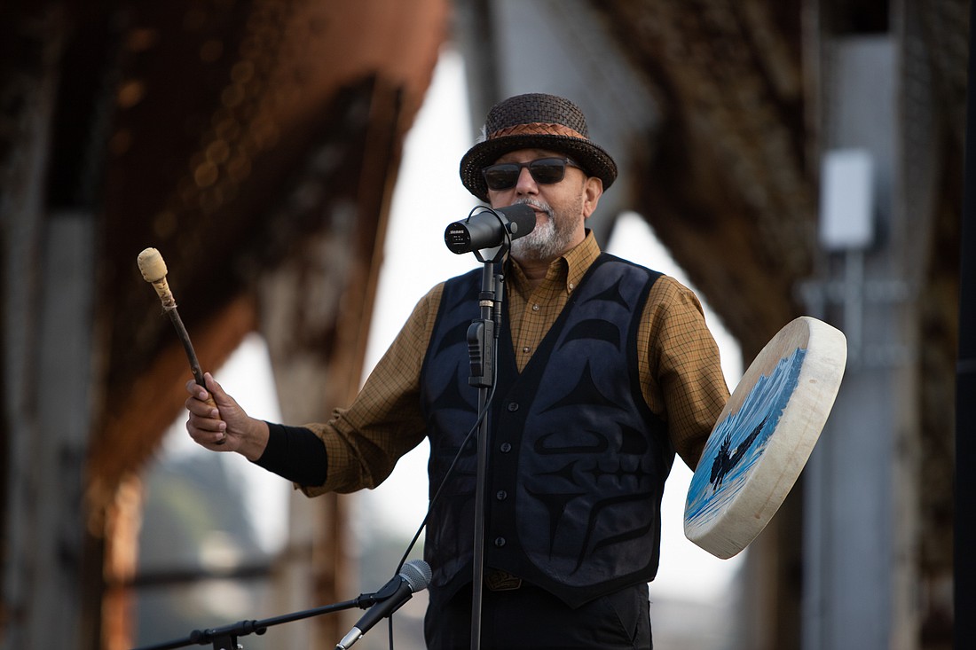 Swil Kanim beats his drum at the start of the blessing ceremony of a Lummi totem pole destined for Pittsburgh, at the downtown waterfront on Sept. 14.